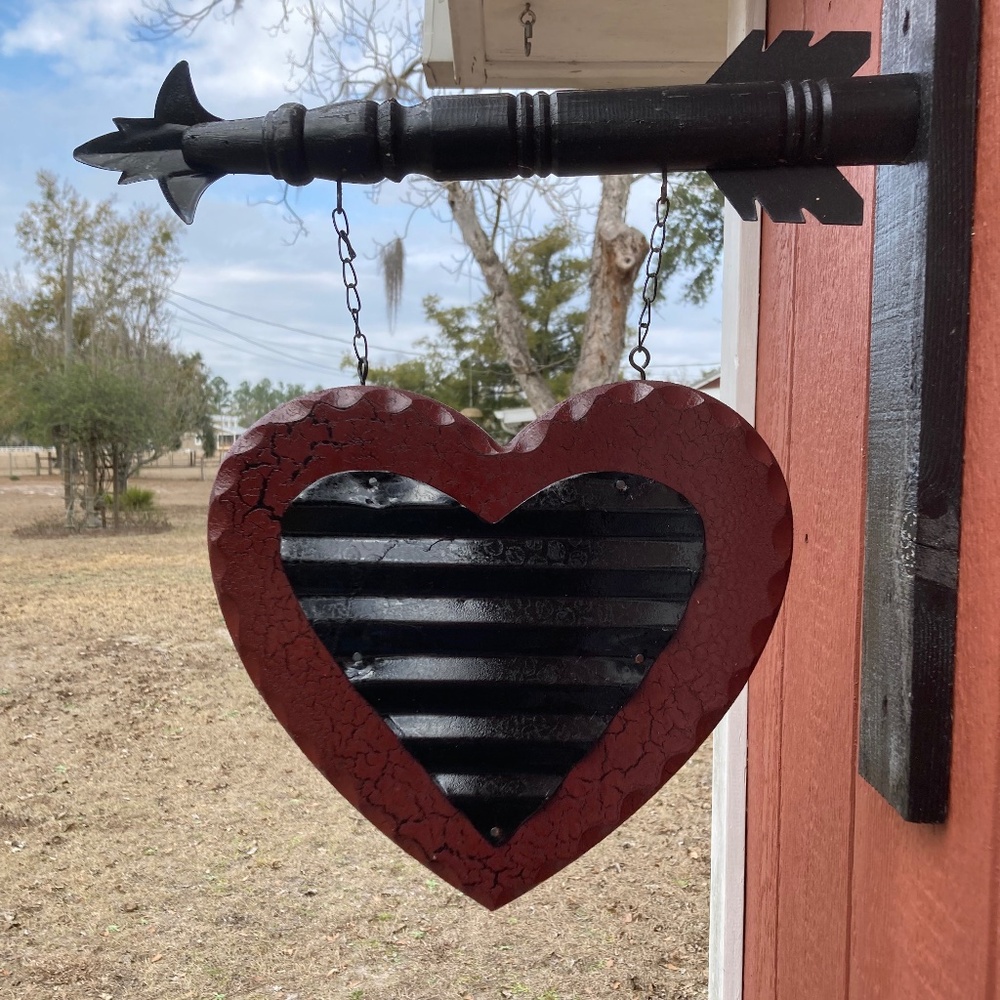 A Red Heart with a small Black Heart.